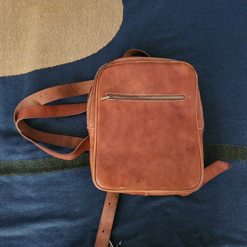 Brown leather backpack.